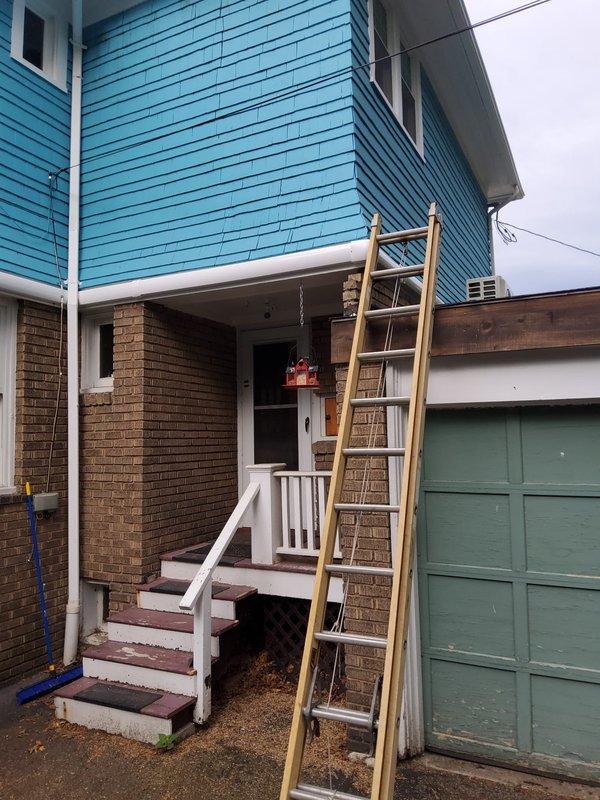 Completed installation of 2-ton multi-zone mini split system on residential property with turquoise-blue sided upper level. Installed three indoor air handling units: 9,000 BTU unit in bedroom, 9,000 BTU unit in kitchen, and 12,000 BTU console unit in living room. Mounted outdoor condensing unit (model 37MGHAQ24DA301) on exterior wall, verified proper electrical connections at 208/230V, 60Hz, 1Ph power supply, and completed refrigerant line sets between outdoor unit and all three zones. System utilizes A2L refrigerant classification per manufacturer specifications. Confirmed all safety labels and wiring diagrams are visible and legible on equipment. Tested system operation across all zones to ensure proper cooling function and airflow distribution.