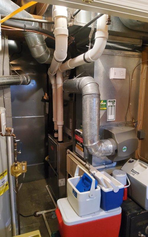 Completed annual air conditioning tune-up on Bryant outdoor condensing unit and indoor air handler system. Performed comprehensive maintenance including inspection of electrical connections, refrigerant pressures, condensate drain system, and all mechanical components. System operating within normal parameters with no deficiencies noted; customer reported no prior issues or symptoms requiring attention.