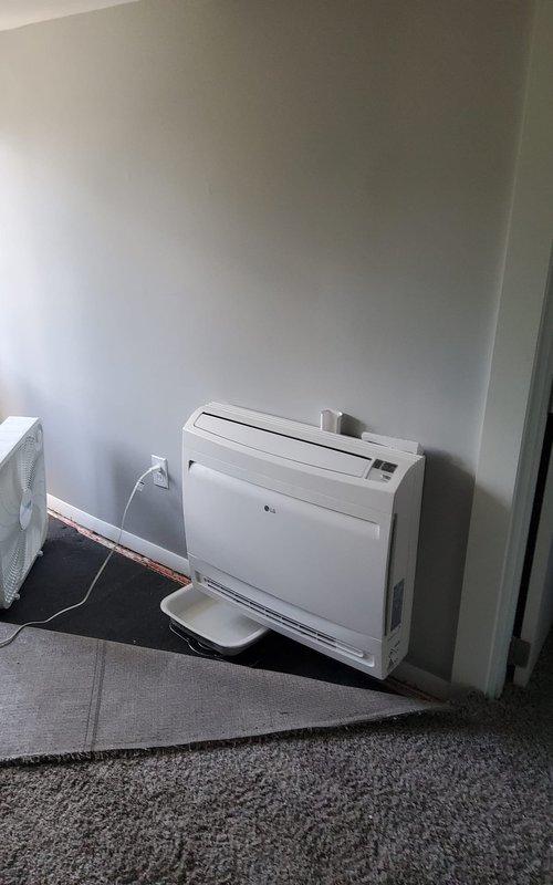 Responded to service call for non-functional one-year-old LG Smart Inverter mini split system displaying persistent error code following recent service. Diagnosed error code on indoor floor-mounted unit and outdoor condenser, performed system reset and troubleshooting procedures, cleared fault code, and restored full cooling operation to the system.