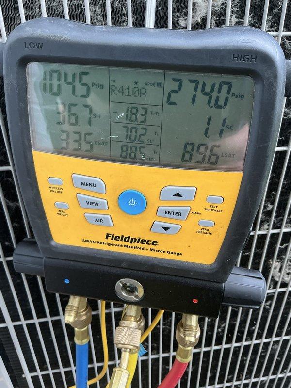 Responded to service call for 2-year-old air conditioning system reported as not working properly. Upon inspection, discovered extensive frost and ice buildup on evaporator coil and blower assembly, indicating restricted airflow or low refrigerant charge. Performed diagnostic testing using refrigerant manifold gauges to measure system pressures and temperatures. Low-side pressure reading of 0.045 psig and high-side pressure of 274.7 psig confirmed severely restricted airflow due to dirty or blocked evaporator coil causing system to freeze.

Shut down system to allow complete defrost of evaporator coil. Inspected air filter and found it heavily soiled, restricting airflow to the system. Replaced air filter with proper size filter. Once coil fully defrosted, verified blower motor operation and checked fan speed settings. Cleaned evaporator coil thoroughly to remove dust and debris accumulation.

After coil cleaning and filter replacement, restarted system and monitored operation. Recheck