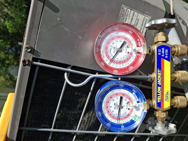 Responded to service call for air conditioning unit that had frozen up and subsequently thawed. Upon arrival, confirmed unit was no longer frozen as reported. Connected Yellow Jacket manifold gauge set to measure system pressures and diagnose refrigerant levels. Testing revealed low refrigerant charge in the system. Performed complete system recharge with appropriate refrigerant type per manufacturer specifications. Verified proper pressures on both high and low side using calibrated gauges. Monitored system operation to ensure proper cycling and cooling performance after recharge was completed.