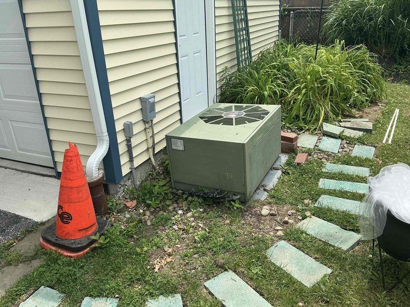 Responded to service call for 20-year-old heating system located in basement. Conducted thorough assessment of existing HVAC equipment, including outdoor condensing unit and indoor components. Documented current system condition through photographic records showing outdoor unit placement, electrical connections, and installation setup. Prepared comprehensive replacement estimate for complete system upgrade, presenting options for modern high-efficiency heating equipment to replace aging unit that has reached end of serviceable life expectancy.