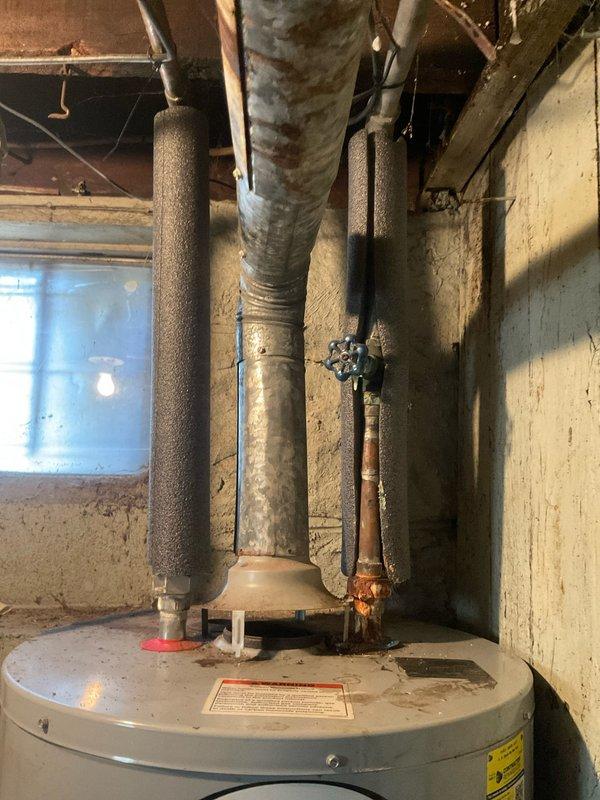 Responded to service call for water heater experiencing sparking at burner assembly with failure to ignite. Upon inspection, diagnosed ignition system malfunction preventing proper gas valve operation and burner lighting sequence. Contacted property owner to report findings and discuss repair options for the malfunctioning tanked water heater unit. Documented existing conditions including aging infrastructure and recommended follow-up service to restore hot water functionality.