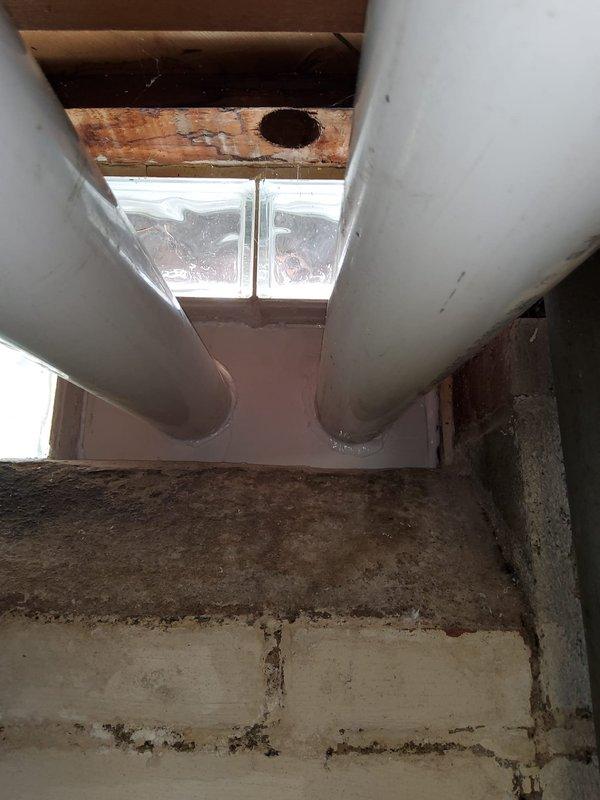 Completed Stage 2 of furnace installation in residential property with basement location. Installed new heating system and connected all ductwork to existing white cylindrical supply runs visible in ceiling area. Addressed structural concerns related to water-damaged wooden framing and deteriorated ceiling materials in work vicinity. Mounted and programmed new digital smart thermostat on main level wall, configured temperature settings to 72°F with scheduled programming to 68°F until 3:05 PM. Verified proper system operation, airflow through supply ducts, and thermostat communication with new furnace unit. Completed all electrical connections and tested heating cycle for proper ignition and temperature control functionality.