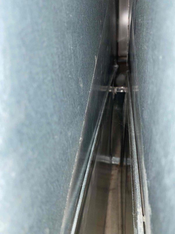 Returned to property to complete installation of return air opening and access panel. Installed dark metal return air grille and secured ductwork connections at return plenum. Work completed per customer's request as scheduled second appointment.