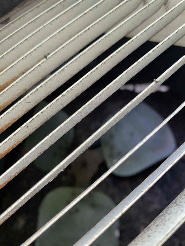 Responded to no cooling call affecting entire residence. Upon arrival, found 40-year-old outdoor air conditioning condenser unit in severely deteriorated condition. Performed visual inspection of exterior unit, noting extensive age-related wear, discoloration, and debris accumulation on condenser coils and housing. Documented unit condition with photographs showing significant staining on louvers and compromised system components. Given the unit's age well beyond typical equipment lifespan of 15-20 years, advised customer that repair would not be cost-effective and recommended full system replacement. Unit has exceeded manufacturer's intended service life by more than two decades and shows multiple signs of end-of-life failure.