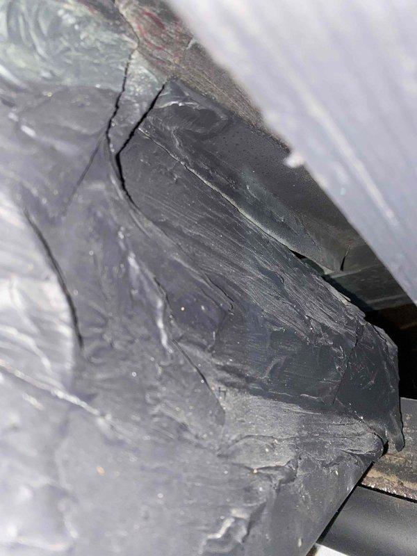 Responded to no-cooling complaint on 9-year-old central air conditioning system. Upon inspection, discovered significant cracking in the evaporator coil assembly, causing refrigerant leak and loss of cooling capacity. System was maintaining airflow but unable to achieve temperature setpoint of 78°F due to compromised coil integrity. Documented damage with photographs showing extensive stress fractures in coil casing and deteriorated surface conditions. Recommended evaporator coil replacement to restore proper system operation and cooling performance.