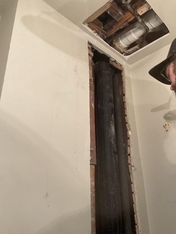 Completed full main stack replacement from basement through first floor lavatory toilet bend continuing to second floor. Removed all existing cast iron stack piping and replaced with Schedule 40 PVC pipe, fittings, bands, cleaner, and glue. Work required opening walls and ceiling to access vertical plumbing chase, removing deteriorated cast iron drainage system, and installing new PVC drainage stack with proper connections and support throughout multi-story run.
