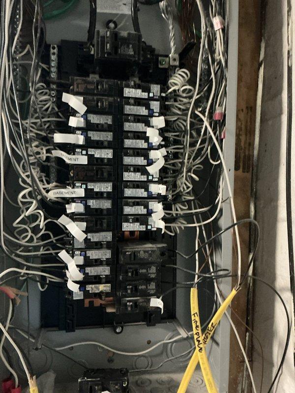 Completed on-site estimate for add-on air conditioning system to complement existing furnace heating equipment. Assessed electrical panel capacity and available circuit breaker positions for new AC unit installation, documented current wiring configuration and main disconnect switch. Evaluated basement mechanical room layout, measured available clearances including 11-foot dimensional requirements, and verified adequate space for condensate drainage, refrigerant line routing, and proper equipment placement alongside existing HVAC infrastructure.