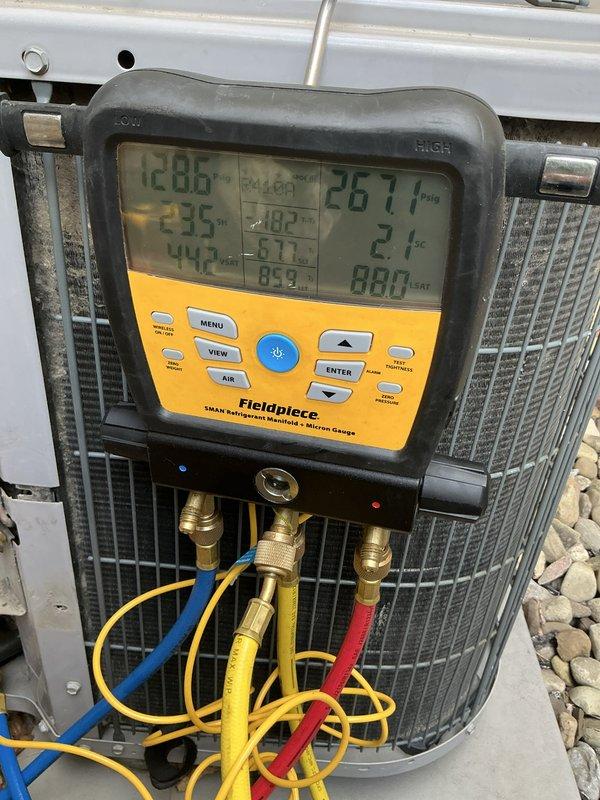 Completed preventive maintenance tune-up on two 10-year-old outdoor air conditioning systems using R-410A refrigerant. Performed comprehensive diagnostics with digital manifold gauges, measuring system pressures and temperatures to verify proper refrigerant charge and operational performance on both units. All equipment found operating within manufacturer specifications with condensers in clean condition.