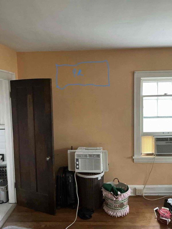 Conducted on-site assessment for mini split installation to replace existing window air conditioning units in residential space. Evaluated room layout, electrical requirements, and optimal placement for indoor unit mounting, marking proposed location on wall. Also performed estimate for gas line installation to service kitchen stove.