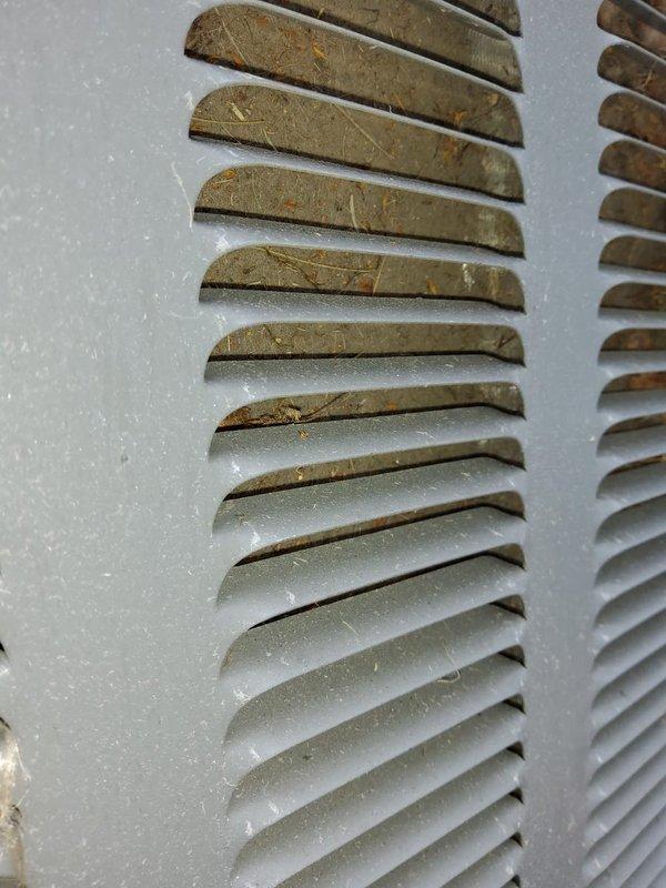 Performed preventative maintenance inspections on four air conditioning systems at commercial facility. Completed comprehensive A/C checks on three air handler units and one package unit, evaluating operational performance, refrigerant levels, electrical connections, and airflow. During inspection, documented significant debris and dust accumulation on condenser coil fins and ventilation louvers, particularly concentrated on upper portions of equipment. Photographed equipment conditions showing heavy dirt buildup affecting heat transfer efficiency on exterior components. Obtained model numbers and documentation photos of combustion unit in boiler room for future replacement planning. All systems assessed for proper operation during moderate ambient temperature conditions.
