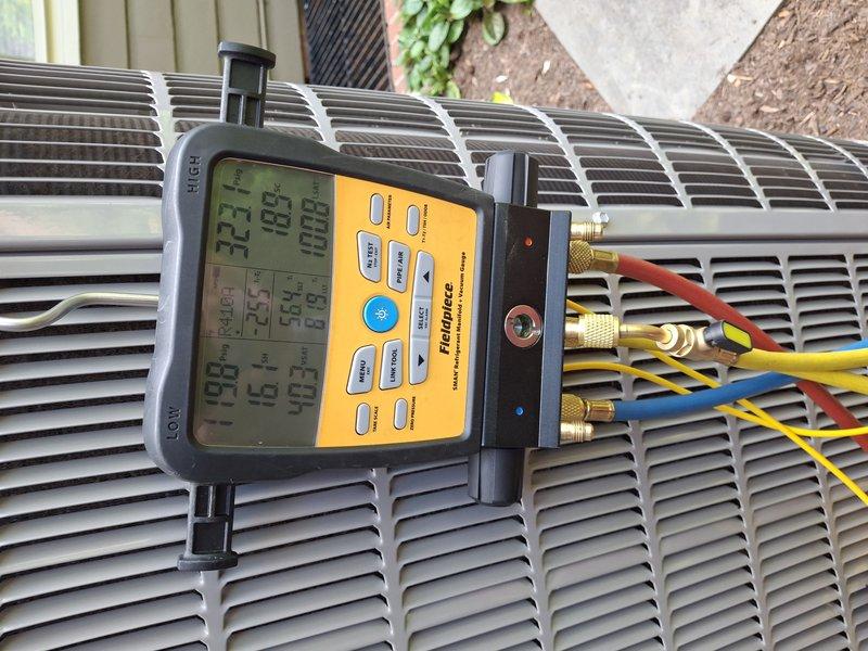 Performed complete AC tune-up on 1-year-old air handler system. Conducted comprehensive system diagnostics using digital gauges to measure refrigerant pressures, temperatures, and superheat readings, confirming proper system operation at 70.2°F ambient conditions. Discussed equipment cover options and ordering process with customer per their request.