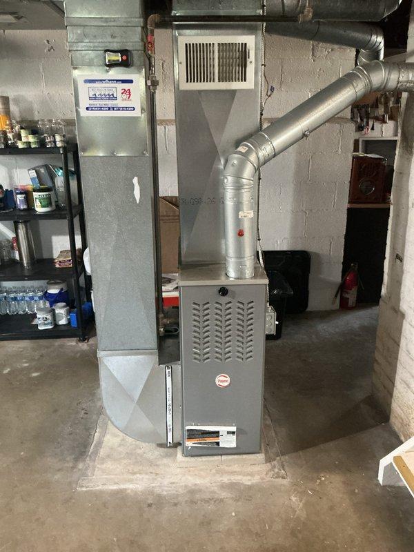 Conducted on-site evaluation for add-on air conditioning system installation to existing forced-air heating system. Assessed electrical panel capacity and available breaker slots for new AC unit, photographed current furnace setup and ductwork configuration to determine compatibility with proposed cooling system, and documented basement mechanical room layout for equipment placement planning.