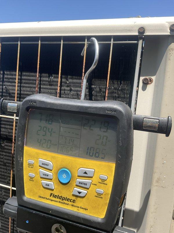 Performed preventive maintenance tune-up on two rooftop air conditioning units, each approximately 20 years old, accessible via deck with ladder access. Conducted comprehensive system diagnostics using digital manifold gauge to measure refrigerant pressures, temperatures, and system performance parameters across both units. Inspected condenser coils, copper refrigerant lines, and aluminum fin assemblies for condition and proper operation. Verified electrical connections at disconnect boxes, tested system controls, and monitored operational readings to ensure both systems were functioning within manufacturer specifications.