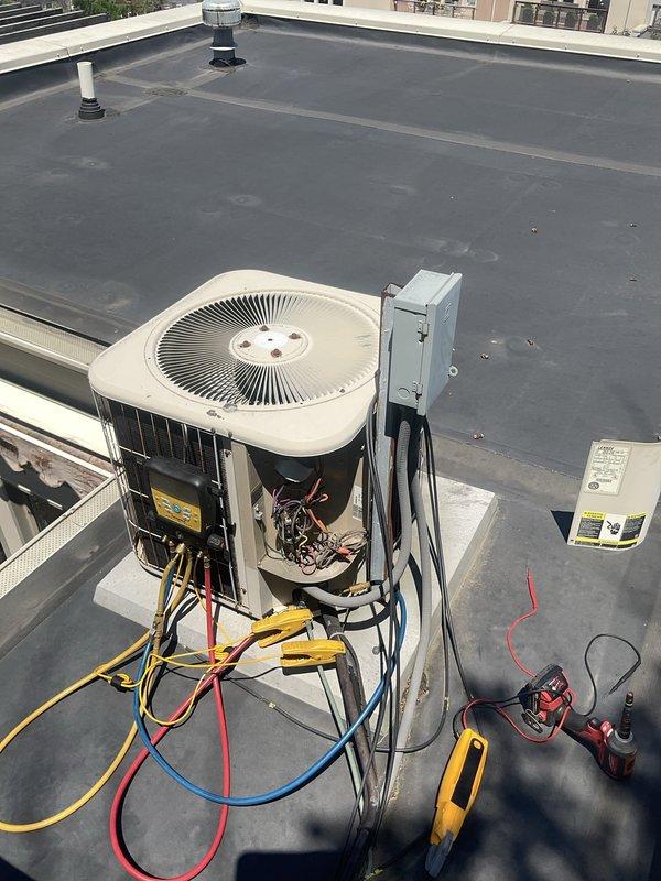 Performed preventive maintenance tune-up on two rooftop air conditioning units, each approximately 20 years old, accessible via deck with ladder access. Conducted comprehensive system diagnostics using digital manifold gauge to measure refrigerant pressures, temperatures, and system performance parameters across both units. Inspected condenser coils, copper refrigerant lines, and aluminum fin assemblies for condition and proper operation. Verified electrical connections at disconnect boxes, tested system controls, and monitored operational readings to ensure both systems were functioning within manufacturer specifications.