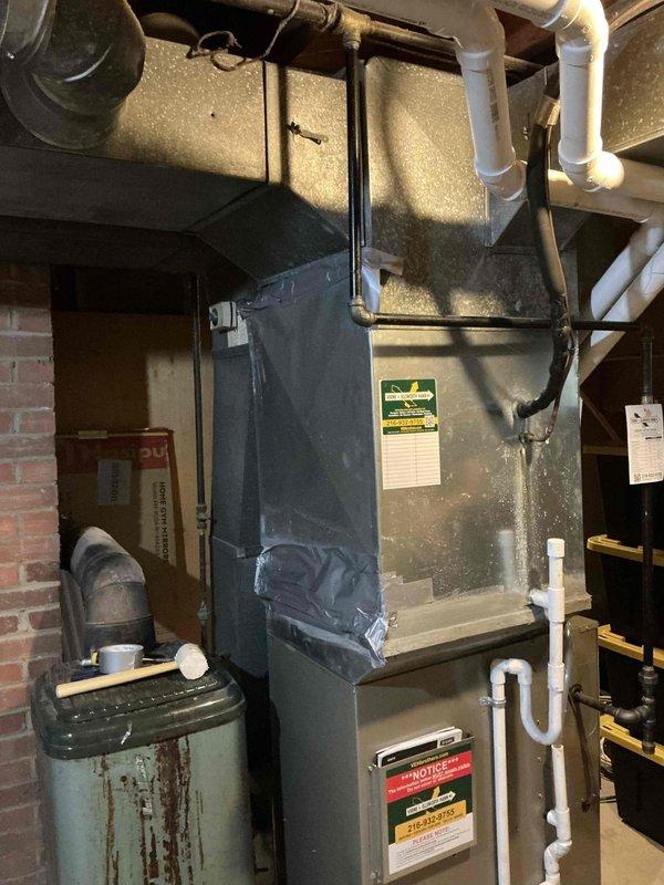 Responded to priority first-call appointment to replace leaking air conditioning system in residential basement mechanical room. Removed and replaced aging AC unit that had developed refrigerant leak of undetermined age. New installation completed alongside existing furnace system that was previously upgraded in 2023, ensuring proper integration with current ductwork, condensate drainage lines, and electrical connections. All PVC piping, refrigerant lines, and duct connections secured and tested for proper operation.