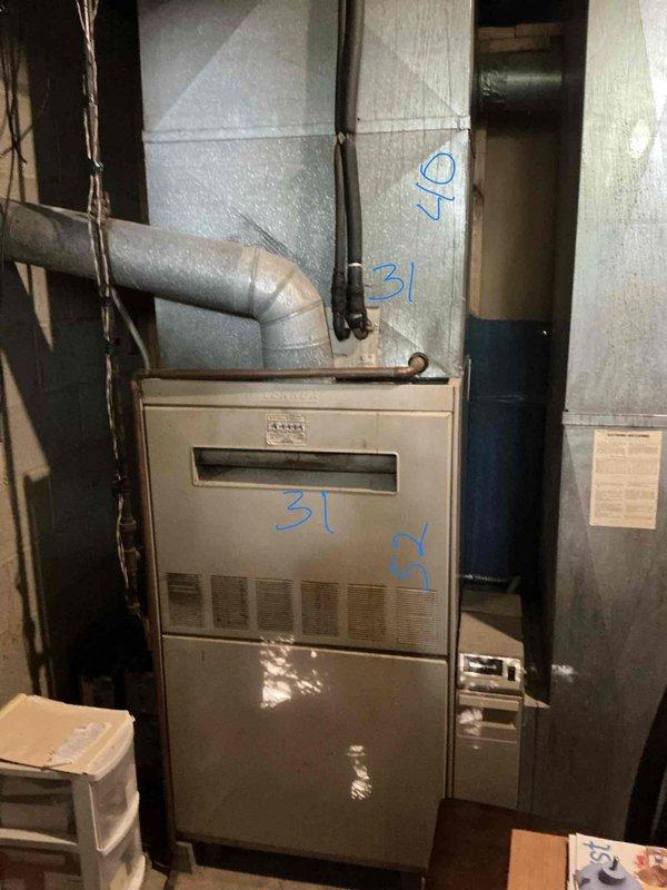 Provided estimate for complete HVAC system replacement including gas furnace and air conditioning unit, both over 20 years old and no longer providing adequate cooling. Assessed existing equipment in basement mechanical room, documented current system configuration with metal ductwork and connections, and presented replacement options to address failed cooling capacity.