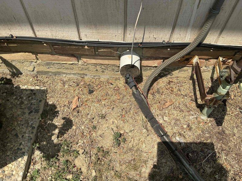 Conducted comprehensive HVAC system evaluation following multiple service calls for inadequate cooling performance. Assessed existing furnace, ductwork configuration, and outdoor condensing unit installation beneath structure. Documented current equipment condition including vertical furnace unit with connected metal ductwork, venting system, and copper refrigerant line set routing through crawl space area. Provided detailed replacement estimate for complete system upgrade to address ongoing cooling deficiencies and restore proper climate control functionality.