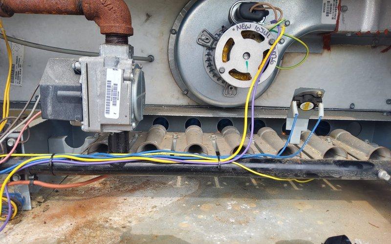 Responded to commercial rooftop unit service call to replace failed inducer motor and pressure switch. Removed old components, installed new inducer motor assembly with proper wiring connections, and replaced pressure switch to ensure safe operation. Cycled unit through multiple heating sequences to verify proper ignition, flame sensing, and burner operation, confirming all safety controls functioned correctly before returning unit to service.