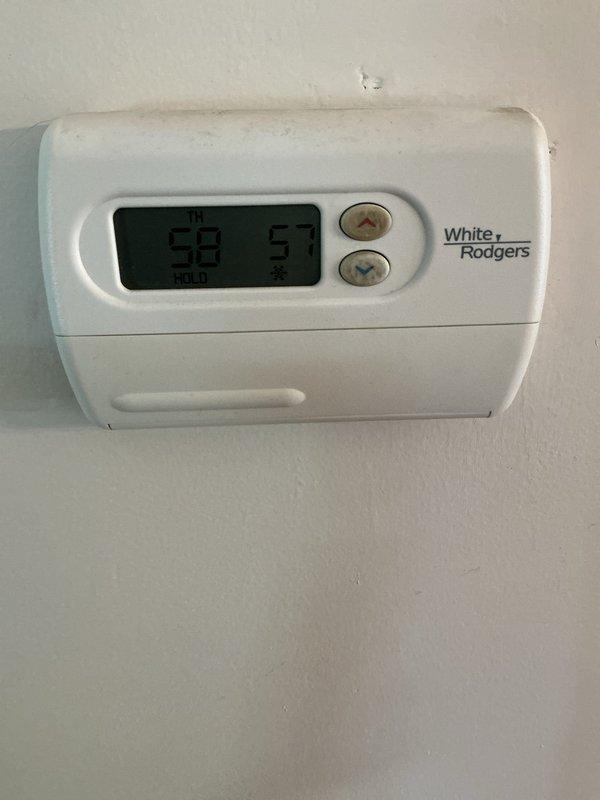 Responded to service call for non-operational air conditioning system. Upon arrival, performed comprehensive AC tune-up and system diagnostic. Identified significant condensation accumulation on interior glass surfaces, indicating excessive indoor humidity levels and potential system performance issues. Verified thermostat operation and display functionality showing current temperature readings. Inspected refrigerant levels, electrical connections, and overall system operation to restore cooling capacity. System returned to normal operating condition with proper cooling output achieved.