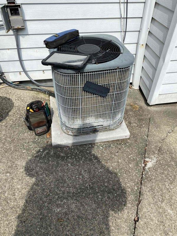 # HVAC Service Report

Responded to emergency no-cooling call on residential air conditioning system. Upon arrival, performed system diagnostic and visual inspection of outdoor condensing unit. Found compressor contactor assembly in severely deteriorated condition with extensive corrosion, dirt accumulation, and oxidation on electrical terminals and connections. White corrosion buildup was prominent around terminal screws and mounting hardware, indicating prolonged moisture exposure and environmental contamination. Multiple wire connections showed signs of compromised integrity due to corrosion at contact points.

Documented equipment condition with photographs showing the extent of deterioration on electrical components. The contactor assembly exhibited heavy rust on metal surfaces and significant debris accumulation that could impair electrical connectivity and system operation. Advised customer of findings and recommended replacement of corroded contactor assembly to restore proper 