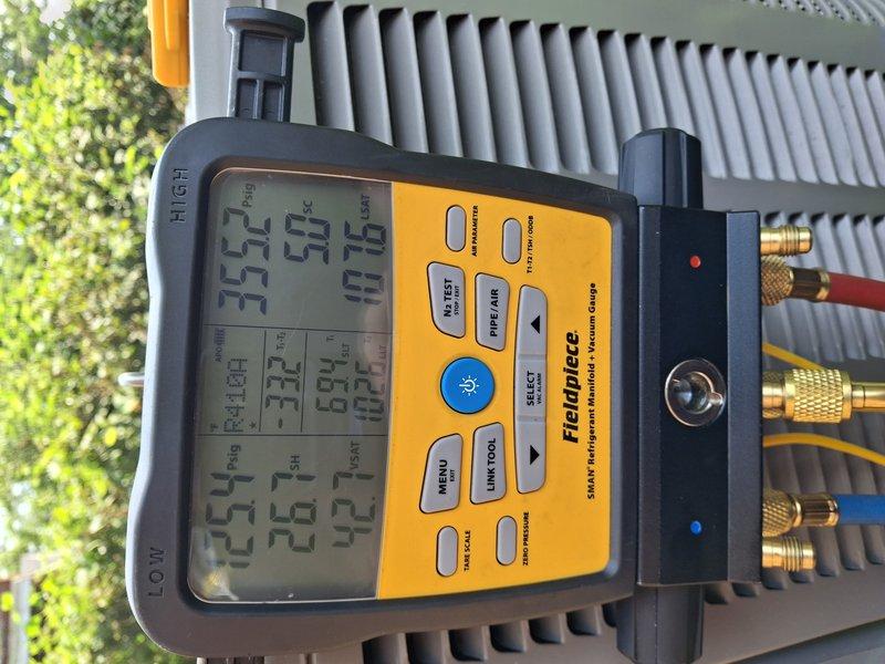 Completed comprehensive tune-up on 10-year-old residential air conditioning system. Performed standard maintenance protocol including system diagnostics using Fieldpiece digital gauges to verify refrigerant pressures and temperatures across the evaporator coil, with all readings indicating proper system operation. Utilized UEi digital measuring instruments to assess additional system parameters and confirm optimal performance of the outdoor condensing unit.