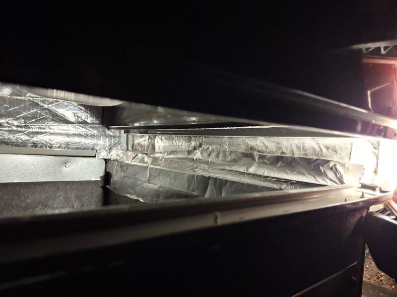 Responded to callback for air conditioning system not cooling. Upon arrival, inspected HVAC system and ductwork in attic space. Found issue with flexible duct connections and sealing at air handler unit. Resealed duct joints with metallic tape to eliminate air leakage. Verified proper airflow through supply ducts and checked foil-faced insulation integrity around distribution channels. System tested and confirmed operational with adequate cooling performance restored.