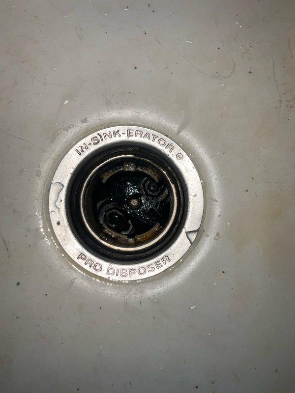 Installed new InSinkErator Pro Series garbage disposal unit in kitchen of 95-year-old home. Completed full installation including mounting assembly, drain connections, and P-trap configuration with PVC piping. Repaired leaking bathroom faucet to restore proper operation and eliminate water waste.