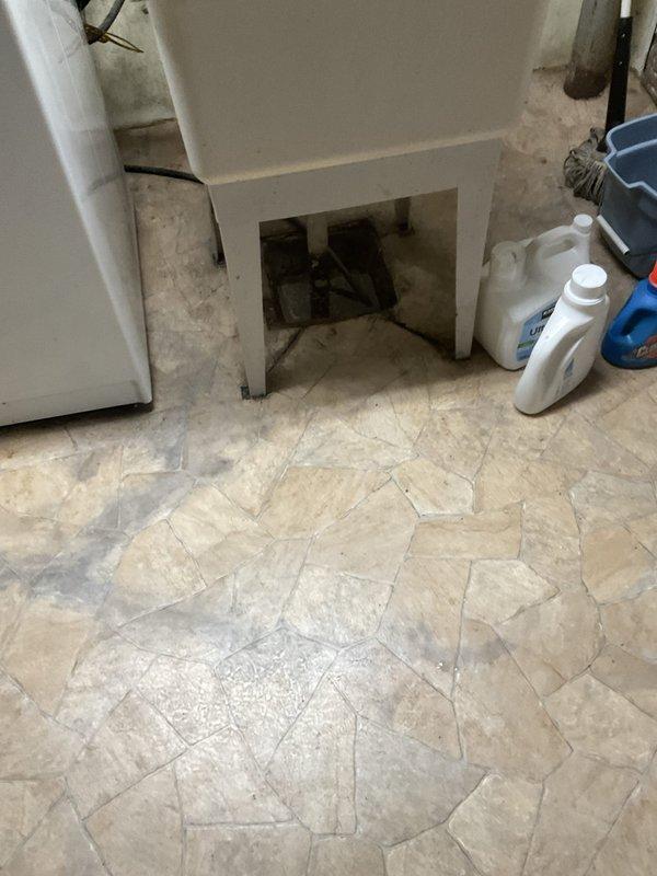 Responded to a clogged drain issue affecting both a floor drain in the utility/laundry room and a third-floor bathroom in a 95-year-old residential property. Upon arrival, assessed the floor drain which showed significant accumulation of debris, grime, and organic matter causing restricted water flow. The drain cover exhibited heavy soiling with buildup blocking the perforated openings. Given the age of the home's plumbing system, evaluated potential complications related to older cast iron or galvanized piping that may contribute to recurring drainage issues.

Cleared the floor drain by removing the drain cover and extracting accumulated debris and blockage material. Utilized appropriate drain cleaning equipment to break up and remove obstructions within the drain line. Addressed the third-floor bathroom clog, which was likely connected to the same drainage system given the simultaneous occurrence of both issues. The vintage plumbing configuration in this older home required careful a
