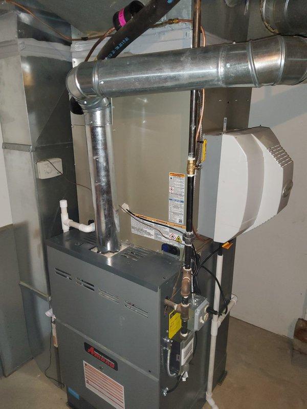 Completed full air conditioning system replacement including evaporator coil installation. Relocated existing Aprilaire humidifier to accommodate new equipment configuration and ensure proper clearances for the updated HVAC system. All refrigerant lines, condensate drainage, and ductwork connections were properly installed and secured to manufacturer specifications, with system tested and verified operational upon completion.