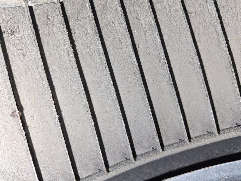Completed annual maintenance on 13+ year old air conditioning system. Inspected condenser coil fins and found moderate dust accumulation; cleaned exterior surfaces to restore optimal airflow. Connected manifold gauge set to measure refrigerant pressures and verified system operating within manufacturer specifications across all parameters.
