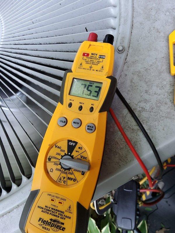 Responded to no cooling complaint on residential air conditioning system. Upon arrival, performed electrical diagnostics using digital multimeter at the outdoor condensing unit. Measured voltage at 133VAC and capacitance reading of 12.2 microfarads at the condenser coil assembly, indicating potential capacitor failure or degradation below manufacturer specifications. Visually inspected condenser coil fins which were found to be clean and in good condition with proper spacing maintained throughout the assembly.