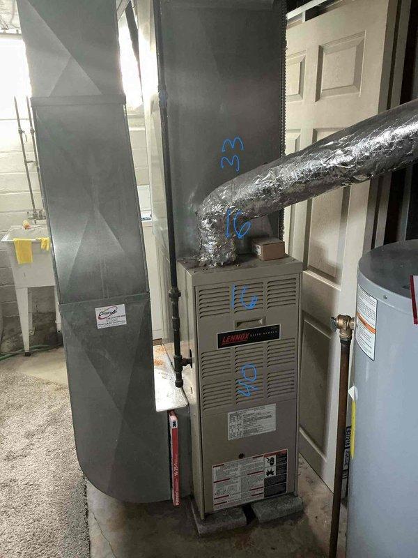 Performed HVAC system evaluation on 1998 air conditioning unit experiencing no cooling condition with suspected refrigerant leak. Inspected Lennox furnace and associated ductwork, documented existing equipment configuration including air handler, flexible ductwork connections, and condensate drain system. Provided comprehensive replacement estimate for complete HVAC system upgrade due to age and condition of existing equipment.