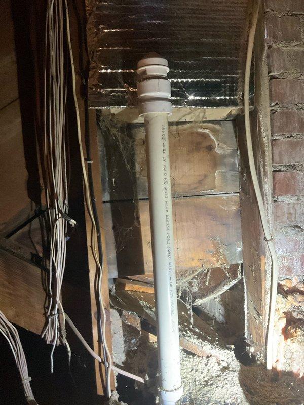 Completed comprehensive plumbing repairs including snaking first and second floor bathroom drains to clear blockages and testing pop-up assemblies for proper operation. Accessed attic space via hallway closet with 6-foot ladder to install air admittance valve on open vent line. In basement, removed existing Fernco coupling on kitchen soil stack and replaced with new 2-inch cast iron to plastic mission band for improved connection integrity. Shut down water supply at main valve and replaced half-inch threaded angle stop valve on cold water supply line serving bathroom faucet. Performed final testing of all plumbing fixtures and connections to verify proper drainage, water flow, and confirm no leaks present throughout system.