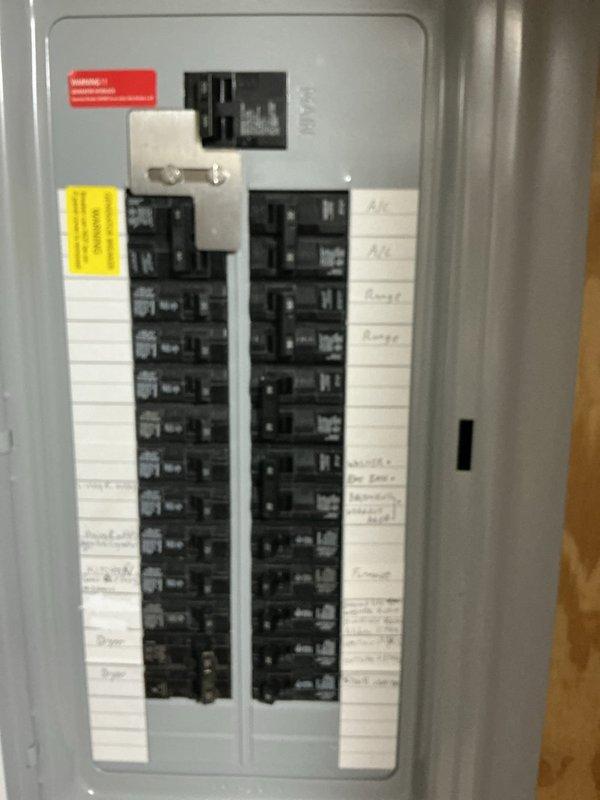 Conducted comprehensive assessment of existing HVAC system for complete replacement estimate. Evaluated 20+ year old gas furnace and air conditioning unit that have reached end of serviceable life. Documented electrical panel configuration and basement utility area conditions, including existing ductwork routing and glass block window placement. Photographed circuit breaker panel to verify electrical capacity for new equipment installation and assessed flexible ductwork condition in mechanical space. Provided detailed replacement estimate for new high-efficiency gas furnace and AC system to customer for approval.