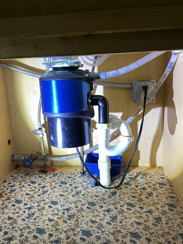 Responded to service call for non-functioning single-handle kitchen faucet in 75-year-old home. Upon inspection, diagnosed failed cartridge assembly in the chrome high-arc faucet unit. Removed and replaced defective cartridge, restored full water flow and handle operation. Tested hot and cold water supply lines, verified proper function of spray nozzle attachment, and confirmed no leaks at connections or base mounting. System returned to normal operating condition.