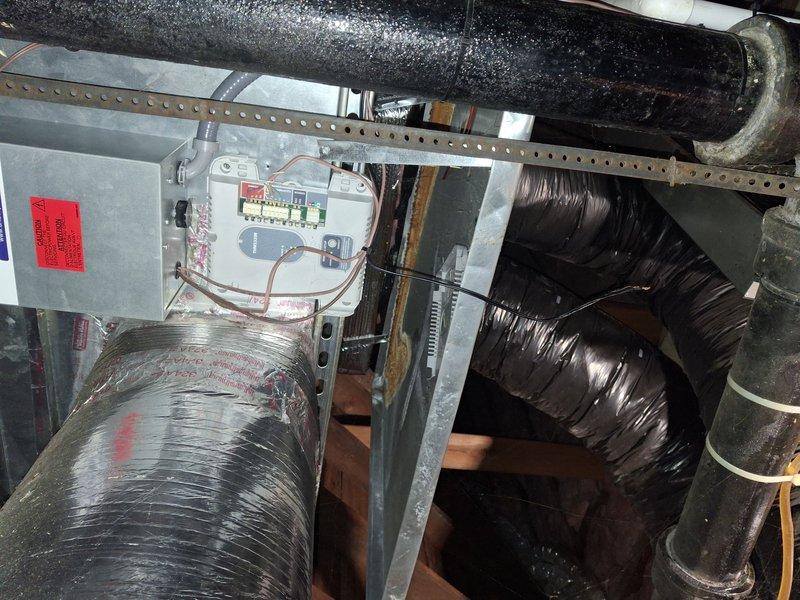 Completed scheduled maintenance on two residential air conditioning systems located in the main home attic. Performed comprehensive inspection of ductwork, electrical connections, and control components. Verified system operation with temperature readings confirming proper cooling performance at 89.3°F, checked all electrical panels and circuit breakers, and inspected insulated ductwork and refrigerant lines for proper installation and integrity.