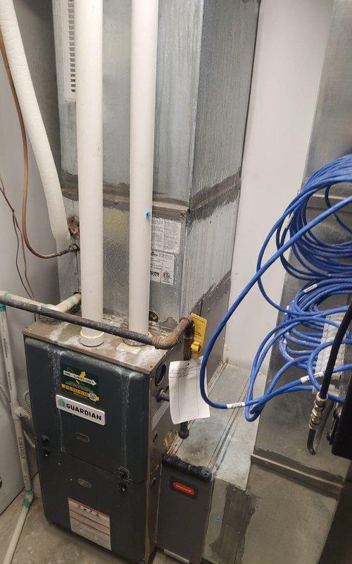 Completed annual air conditioning tune-up on 5-year-old residential system with Guardian furnace. Performed standard maintenance inspection, verified all mechanical and electrical connections, checked refrigerant levels, and documented equipment condition with photos. System operating within normal parameters with no immediate concerns identified.
