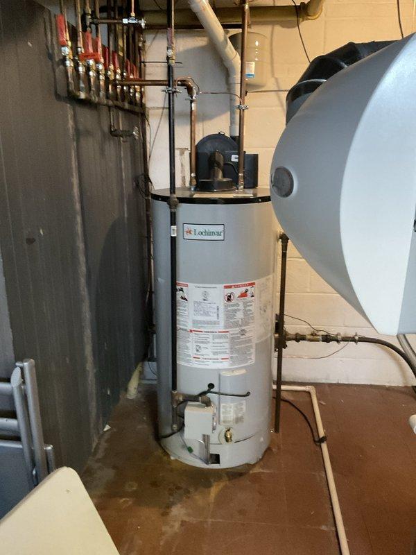 Responded to service call for non-operational Lochinvar tanked water heater that failed to restart after gas service was temporarily interrupted for gas leak repair. Upon arrival, inspected unit which had been functioning properly prior to 24-hour gas shutoff. Performed diagnostic evaluation of gas control valve, pilot assembly, and thermocouple connections. Verified gas supply restoration to unit and checked all safety controls. Successfully re-established pilot light operation and confirmed main burner ignition sequence. Tested water heater for proper heating cycle and verified all connections secure with no gas leaks detected at appliance.