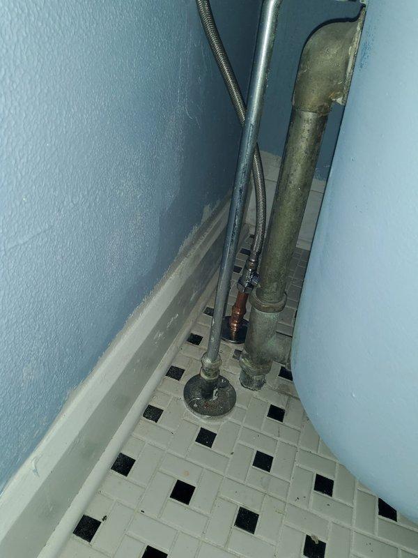 Completed repipe installation to third-floor bathroom, installing eight new shut-off valves (six 1/2" and two 3/4") and running new PEX water supply lines. Accessed ceiling cavity and walls to route new plumbing lines, replacing deteriorated copper piping that showed significant corrosion and oxidation with modern PEX tubing for improved longevity and performance.