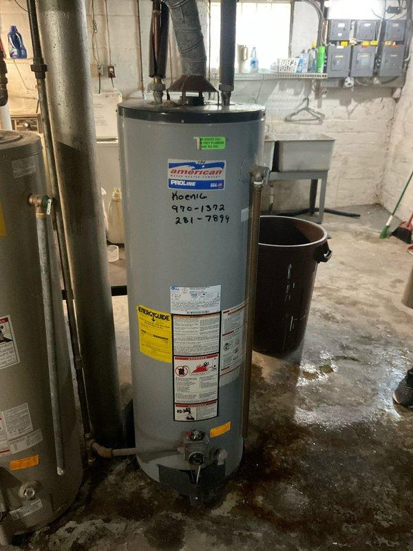 Conducted comprehensive evaluation of three gas-fired tank water heaters in residential basement mechanical room to determine repair versus replacement recommendations. The units varied in age from 5-6 years to 10-12 years old, with visible evidence of water staining on concrete floor surrounding equipment bases indicating potential leak history. Documented existing conditions including manufacturer specifications, model information, and current installation configurations for American, Rheem, and A.O. Smith ProMax units, noting plumbing connections, venting systems, and overall operational status to provide accurate estimate for either individual repairs or complete system replacement.