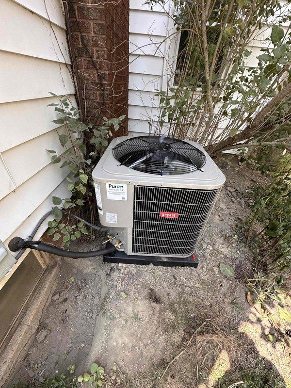 Completed full air conditioning system replacement including outdoor condensing unit and evaporator coil. Installed new Bryant condenser on existing concrete pad with proper refrigerant line connections and electrical hookup. Evacuated system using vacuum pump to manufacturer specifications, charged unit with refrigerant, and verified proper operating pressures and temperatures. System tested and operating within normal parameters upon completion.