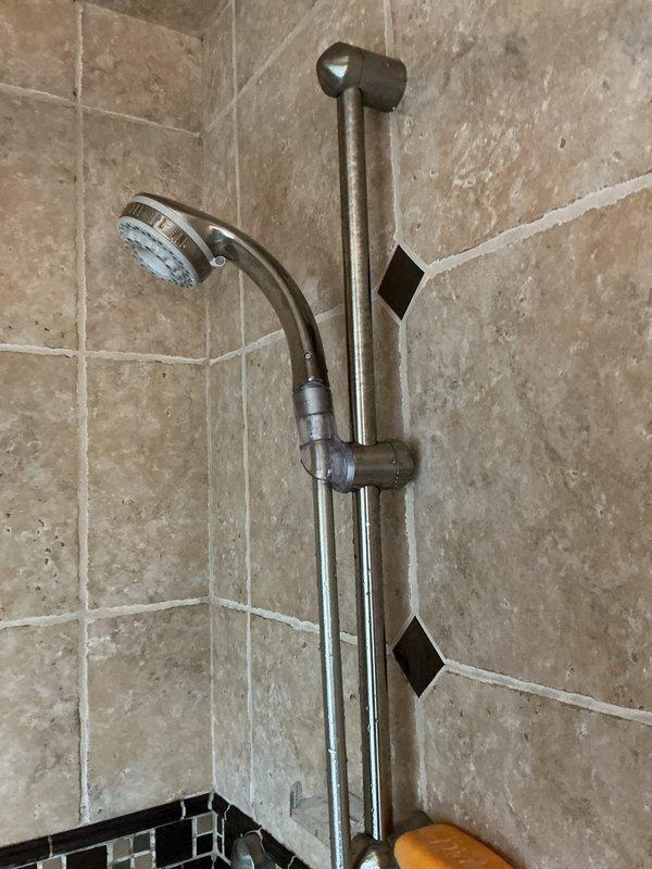 Serviced and evaluated three Hansgrohe faucet fixtures in residential shower installation. Inspected handheld shower system with chrome-finished slide bar assembly, adjustable bracket mechanism, and flexible hose connection, ensuring proper mounting bracket security and operational functionality. Confirmed brand compatibility and completed necessary repairs to restore fixtures to proper working condition.