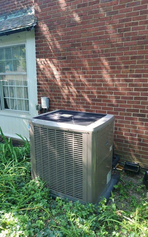 Completed comprehensive maintenance tune-up on 4-year-old outdoor air conditioning unit located on exterior concrete pad against brick wall. Performed full system inspection including refrigerant levels, electrical connections, condenser coil cleaning, and operational testing during high ambient temperature conditions (91°F). All components found operating within manufacturer specifications with no deficiencies noted.