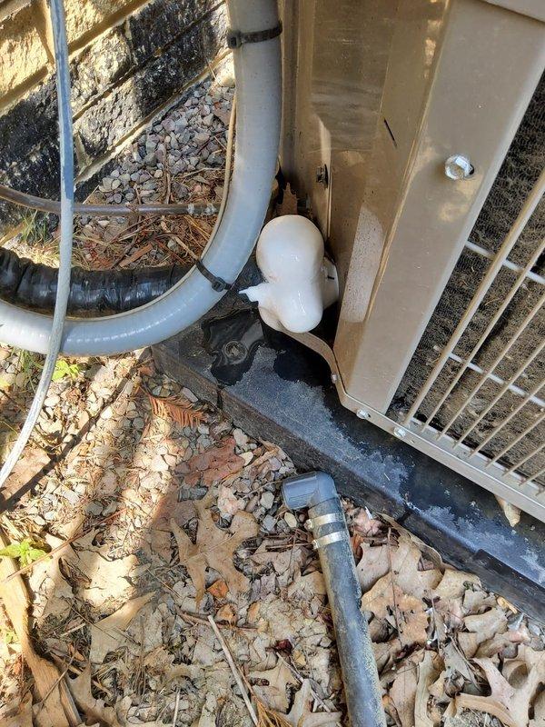 Responded to service call for air conditioning system not operating properly, affecting entire home. Upon arrival, performed comprehensive system inspection of less than one-year-old unit. Examined outdoor condensing unit, verifying proper installation on concrete pad with adequate drainage configuration via PVC condensate lines and P-trap assembly. Inspected indoor components including refrigerant line sets with foam insulation and associated ductwork connections. Conducted operational testing of system components, checked refrigerant pressures, verified electrical connections, and assessed airflow throughout system. Documented equipment condition with photographs for service records. System restored to proper working order and homeowner advised of findings.