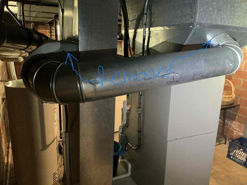 Completed HVAC system assessment for nearly 21-year-old air conditioning unit with no cooling capability. Documented existing Lennox furnace installation and ductwork configuration in basement mechanical room, noting system age and condition to provide comprehensive replacement estimate for aging equipment requiring full system upgrade.
