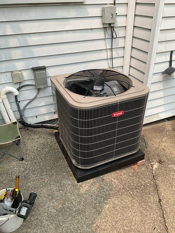# HVAC Install - A/C & Coil

Completed full system replacement including outdoor condensing unit, indoor evaporator coil, and thermostat upgrade. Installed new Rheem condensing unit on existing concrete pad with proper clearances and secured electrical disconnect box. Connected refrigerant lines using copper piping and completed all necessary brazing connections. Mounted new evaporator coil to existing air handler in basement, ensuring proper integration with furnace system. Installed white PVC condensate drain lines with appropriate pitch for gravity drainage. Ran new electrical conduit from disconnect to outdoor unit and wired thermostat control system. Pressure tested refrigerant lines, evacuated system to manufacturer specifications, and charged unit with appropriate refrigerant per nameplate data. Verified all electrical connections, tested system operation through complete cooling cycle, and confirmed proper airflow and temperature differential across coil. All work completed to 
