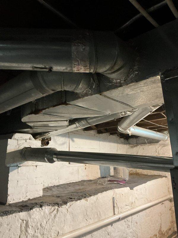 Completed comprehensive HVAC system evaluation for potential home buyer, including thorough inspection of furnace, ductwork, and air conditioning components in basement mechanical room. Assessed supply and return duct system condition, examined flexible ductwork connections, and evaluated overall system integrity and operational status. Documented findings with photographic evidence of furnace unit, ductwork routing, and mechanical connections to provide complete assessment for pre-purchase decision-making purposes.