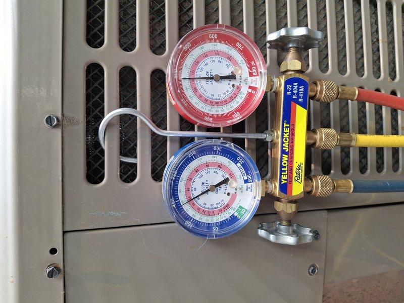 Responded to service call for HVAC system requiring refrigerant charge. Used Yellow Jacket manifold gauge set to diagnose system pressures and verify refrigerant levels. Added refrigerant to bring system to manufacturer specifications and confirmed proper operating pressures using digital clamp meter to verify electrical readings. System restored to full cooling capacity and tested for proper operation.